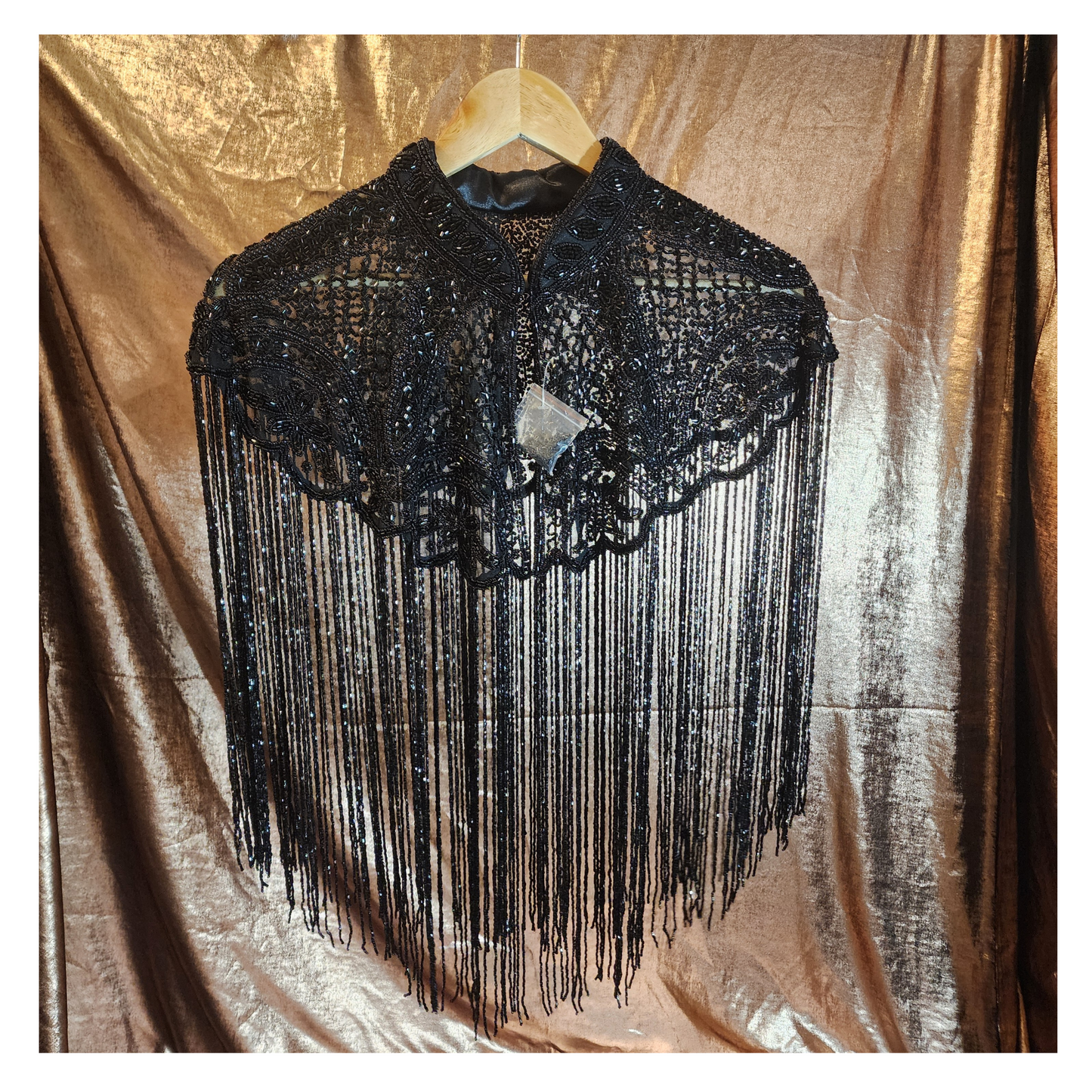 Hand-beaded on breathable mesh with soft tassels — designed to elevate any outfit.