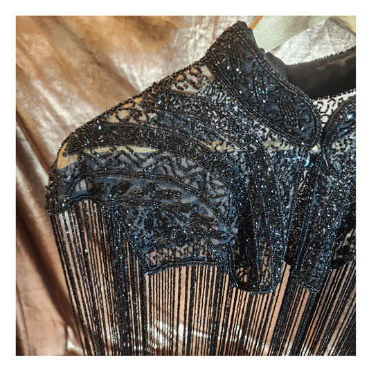 Hand-beaded on breathable mesh with soft tassels — designed to elevate any outfit.