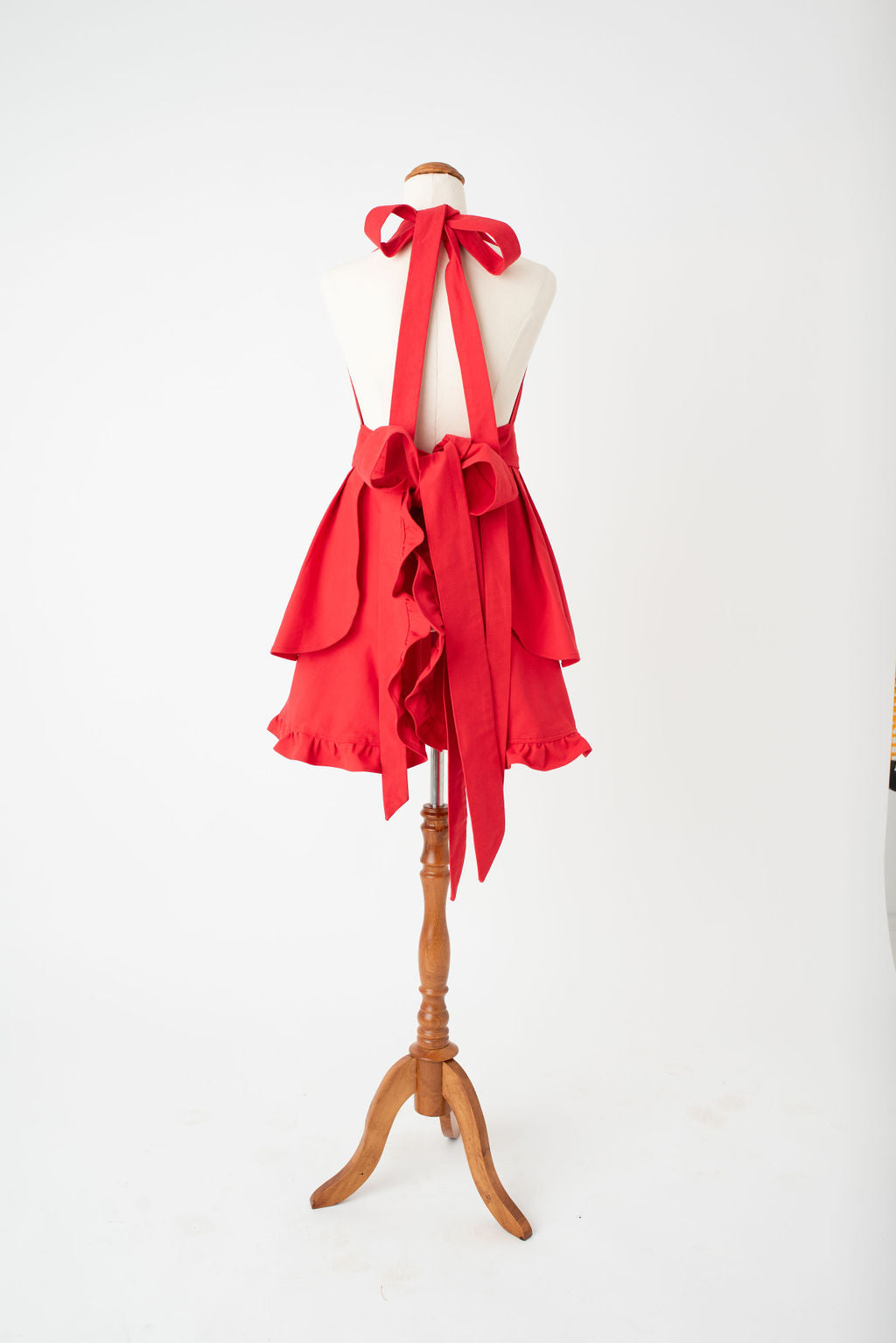 Vintage frilly hostess apron in red by Pretty Made - back bow