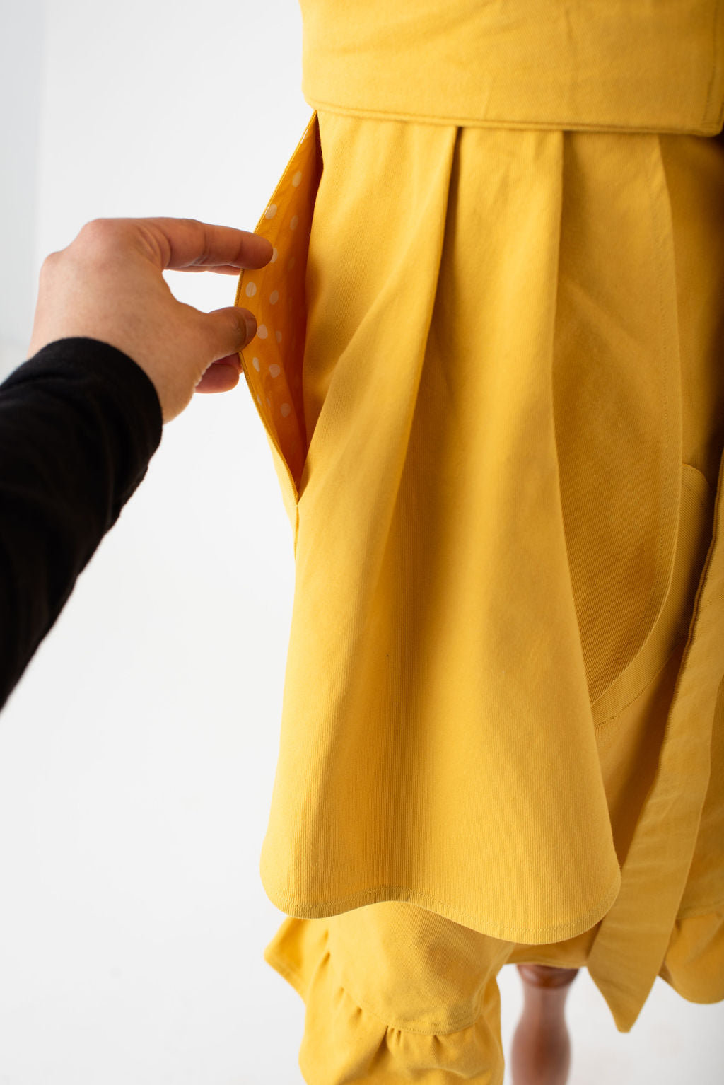 hostess apron in yellow by Pretty Made - polka dots pocket detail