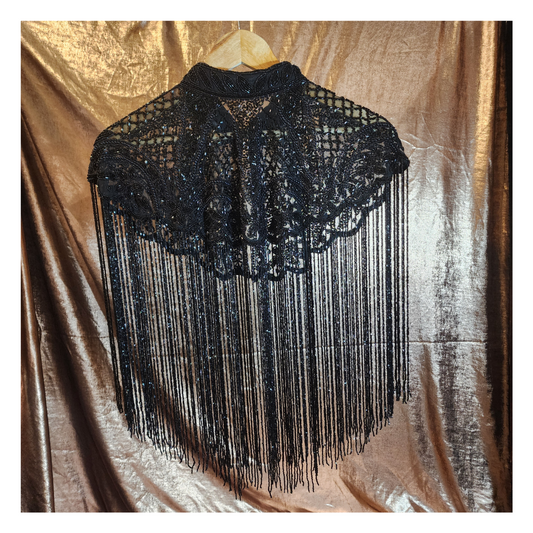 Hand-beaded on breathable mesh with soft tassels — designed to elevate any outfit.