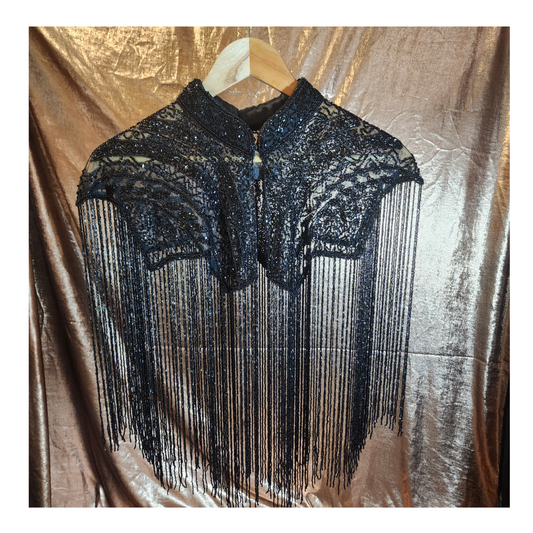 Hand-beaded on breathable mesh with soft tassels — designed to elevate any outfit.