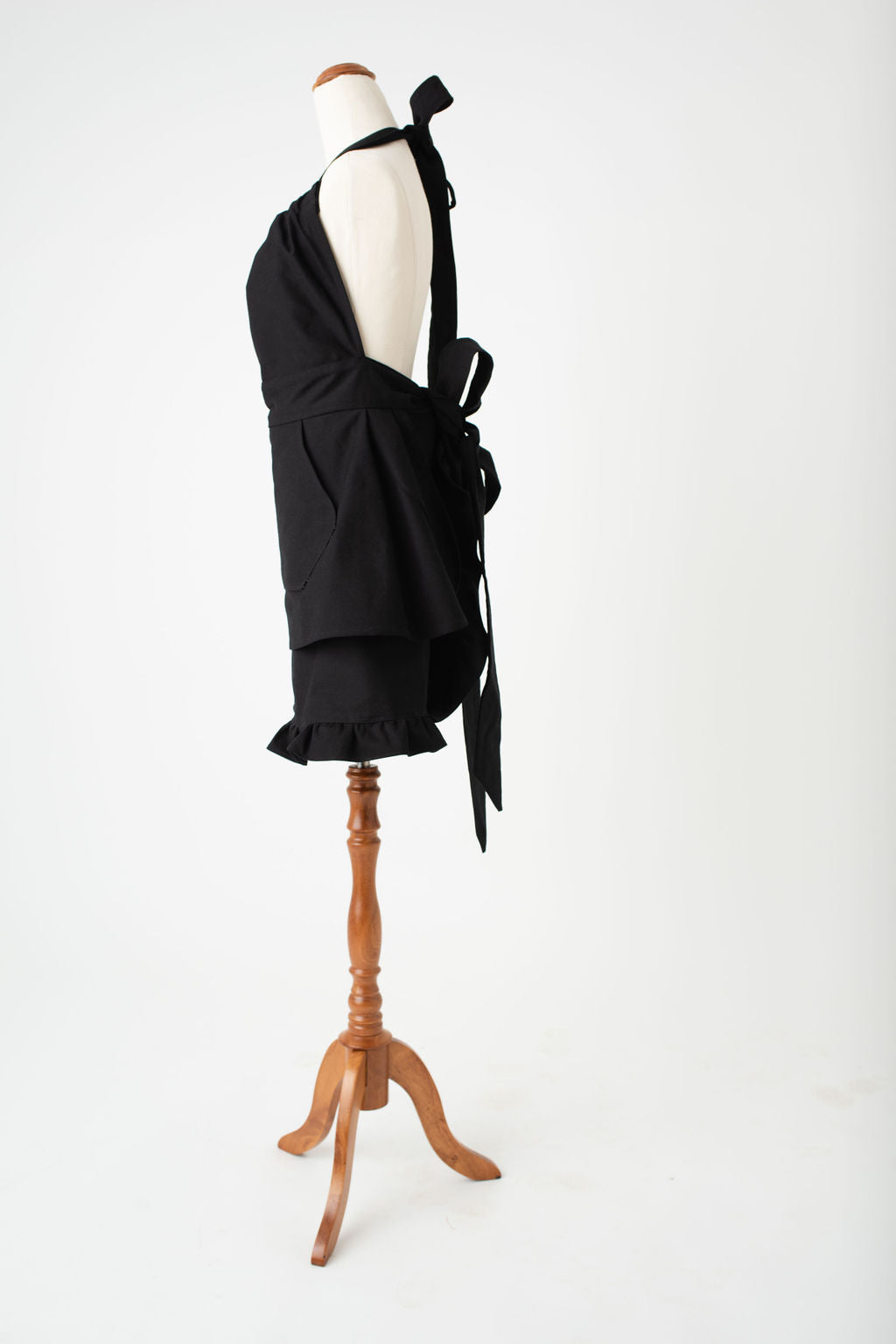 High waist feminine hostess apron in black by Pretty Made - Left side