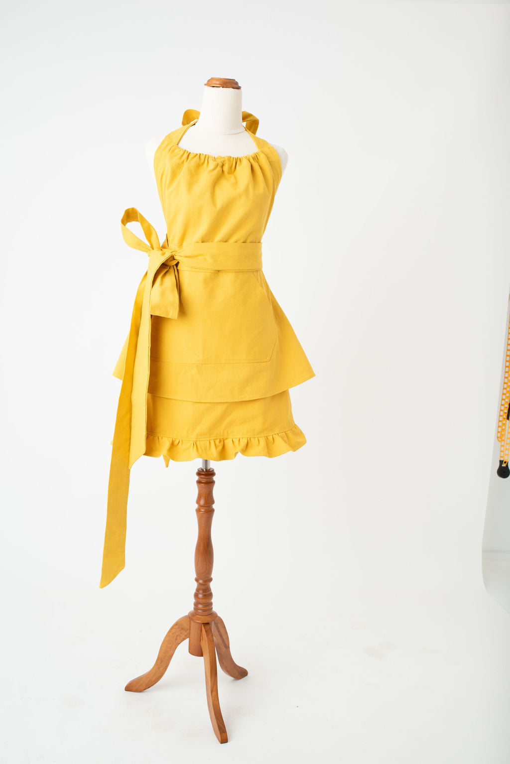 High waist feminine hostess apron in yellow by Pretty Made - Front bow