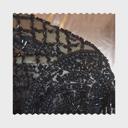 Hand-beaded cape on breathable mesh with soft tassels — designed to elevate any outfit.